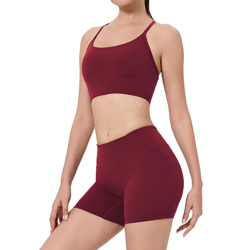 Women's High-Waist Fitness Set: Sports Bra with Pads, Beautiful Back Design, and Three-Point Peach Lift Shorts for Yoga and Pilates.