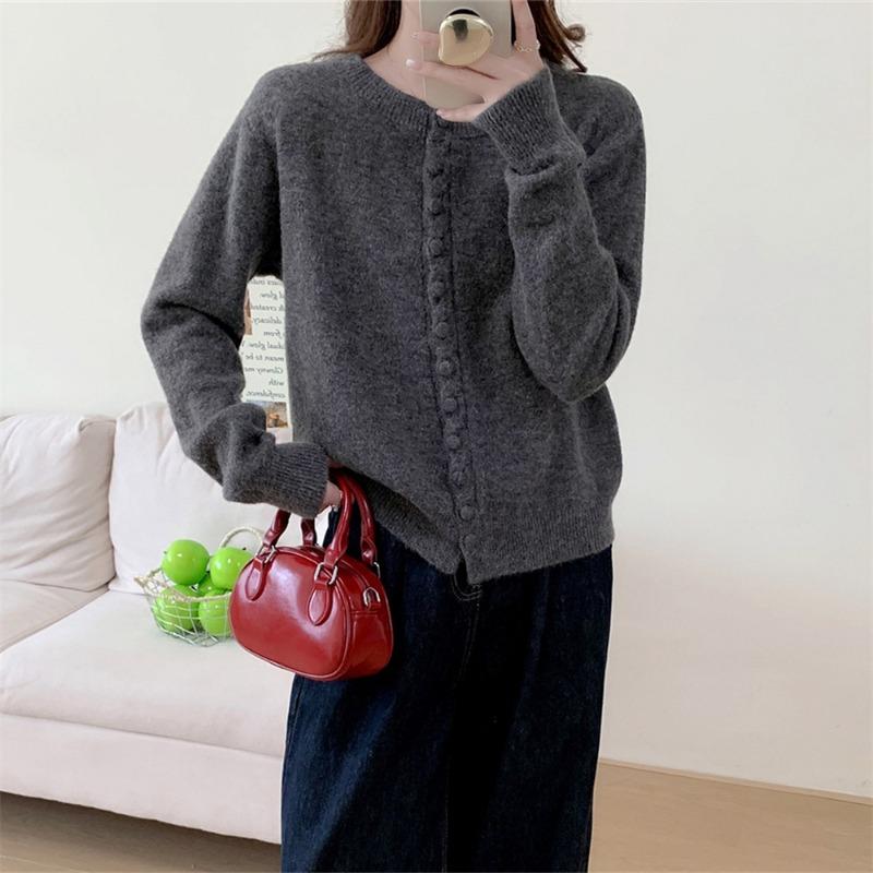 Autumn new solid color round neck single-breasted splicing long-sleeved knitted sweater women's fashion age-reducing top