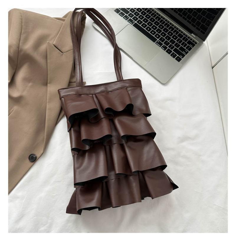 Neue Handtaschen sind trendige, einfarbige, personalisierte Plissee-Schultertaschen, modische und vielseitige Eimertaschen mit großem Fassungsvermögen.