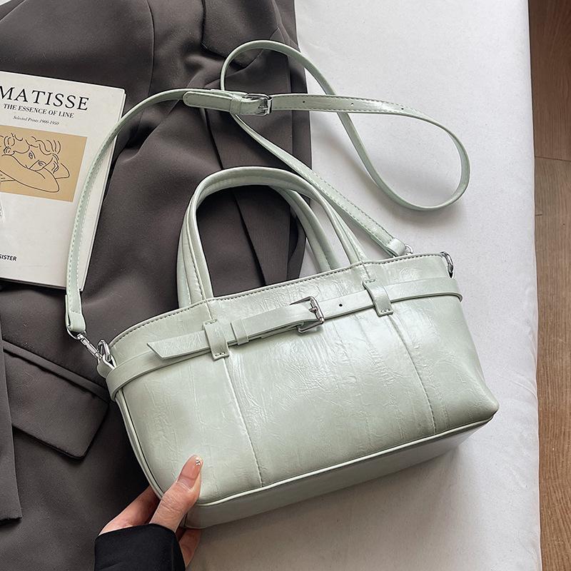 

Популярная новая корейская версия нишевой повседневной сумки-ведра из портативной кожи с масляной восковой пропиткой, модная и простая, универсальная сумка-мессенджер для通勤 для женщин