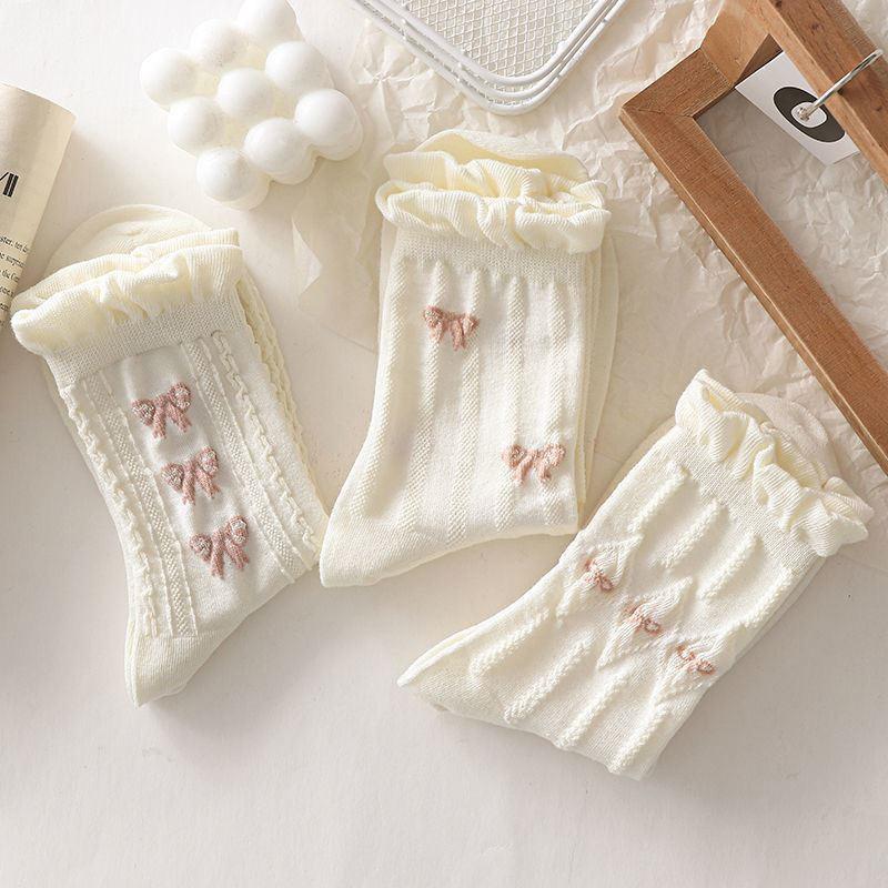 Chaussettes blanches simples, polyvalentes, jolies, nœuds papillon, petites fleurs, chaussettes tube moyennes pour femmes, Kawaii Harajuku Jk Lolita, chaussettes en coton pour filles