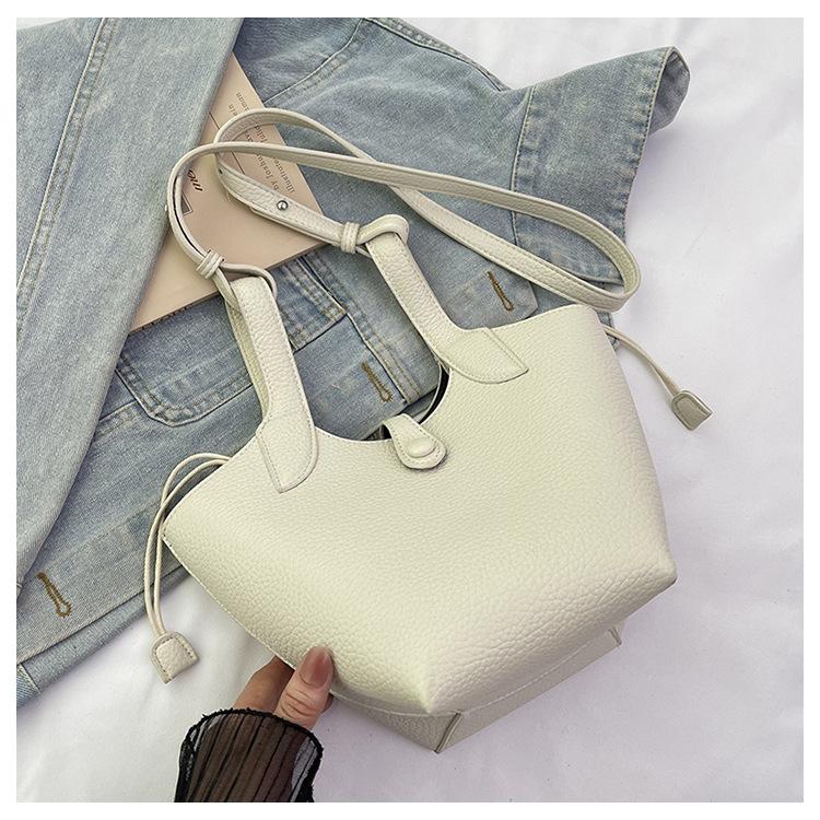 2025 New Versatile Niche Design Vegetable Basket Women's Bag High-end Texture Commuter Portable Messenger Bag Women's Trend