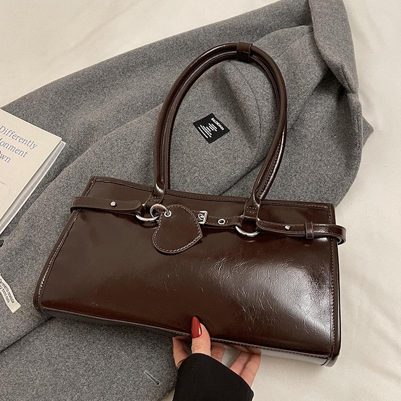 

Early spring new product niche design personalized oil wax leather underarm baguette bag versatile commuting temperament portable shoulder bag women