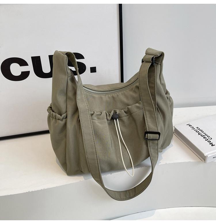 Canvas Ladies Crossbody Bag With Solid Color Drawstring Design For Daily Use And Urban Style