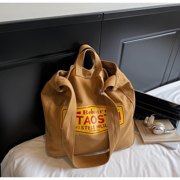 

Korean niche tote bag canvas bag women s 2025 new large capacity casual tote bag fashion letter crossbody bag хакі