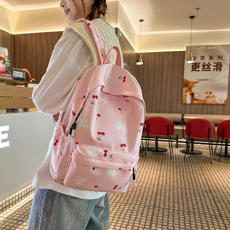 Korean small fresh schoolbag female college student simple small floral backpack lightweight large capacity high school backpack