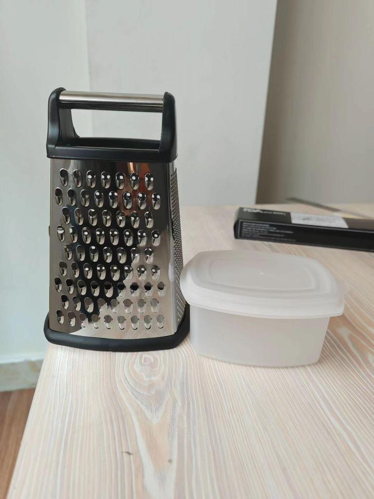 Stainless Steel Multi-Functional 4-Sided Grater and Peeler for Melons, Fruits, Ginger, Garlic, and Cheese