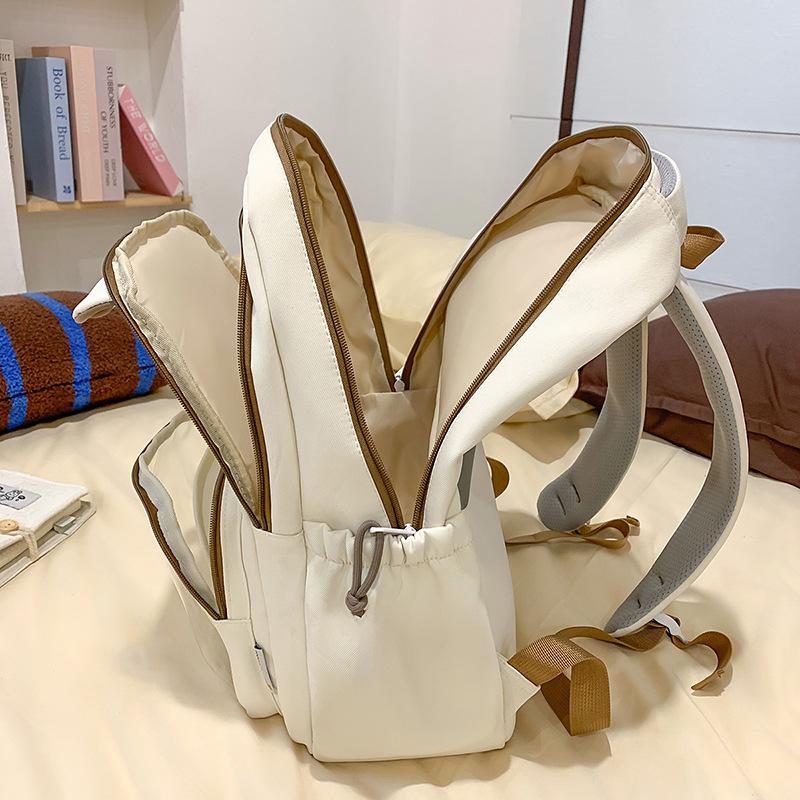 Schoolbag female new cute ugly cute cartoon pain layer backpack high value primary and secondary school students large capacity backpack male