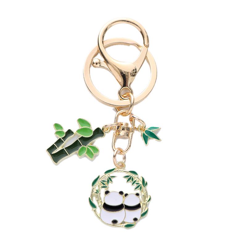 Quirky Cartoon Panda Alloy Keychain Pendant with Cute Bamboo Leaf Design - Earphone Case & Bag Decoration