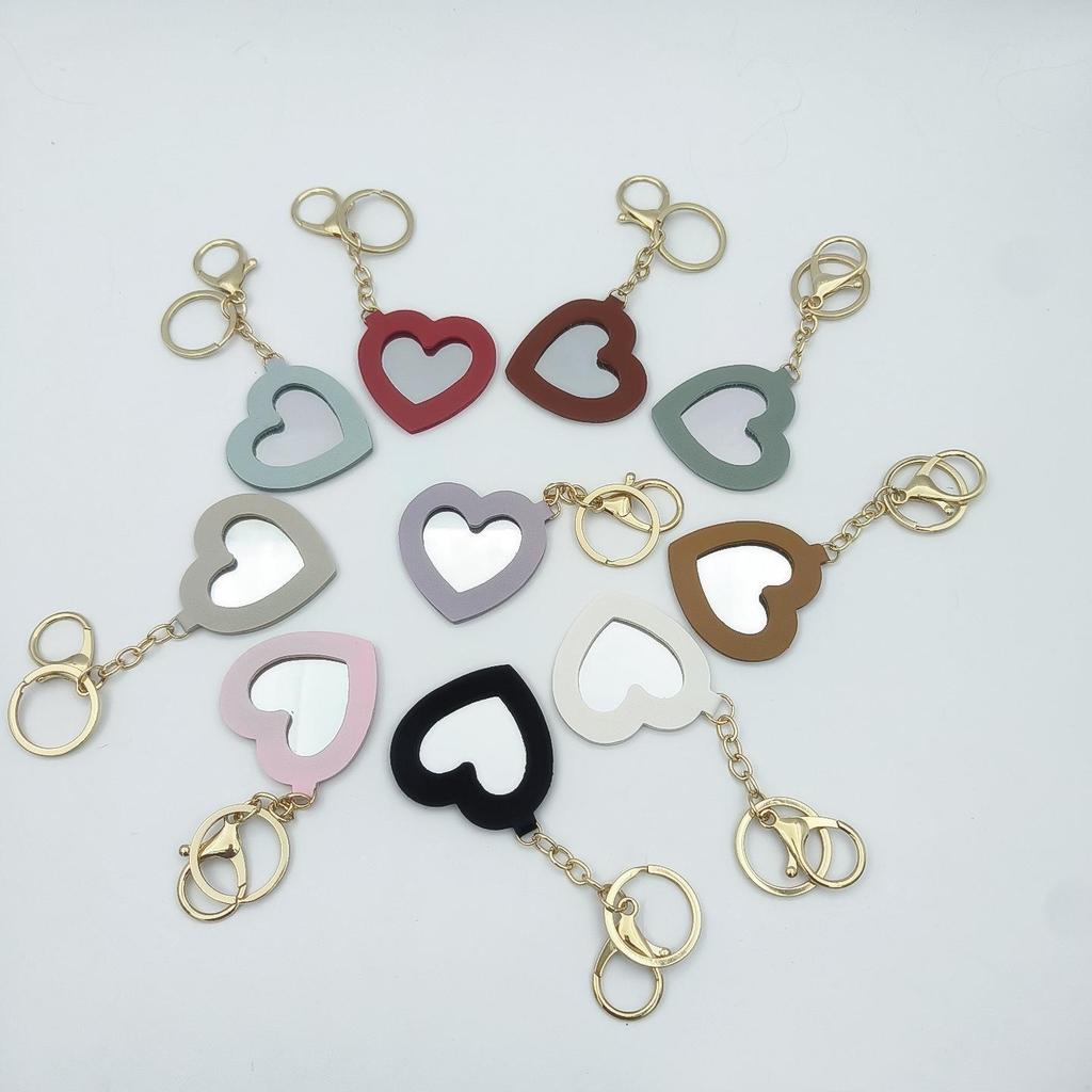 Přenosné pouzdro na rtěnku ve tvaru srdce s ochrannou kůží a roztomilou klíčenkou s přívěskem