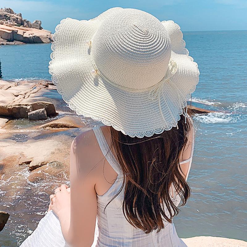 Straw hat women's small fresh and versatile pearl tether bow hat women's summer outing big eaves beach sun hat