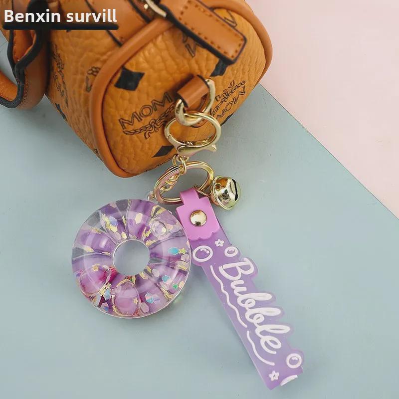 Luminous Oil-Filled Donut Quicksand Keychain: Exquisite Car Pendant & Bag Accessory, Ideal for Gifts.