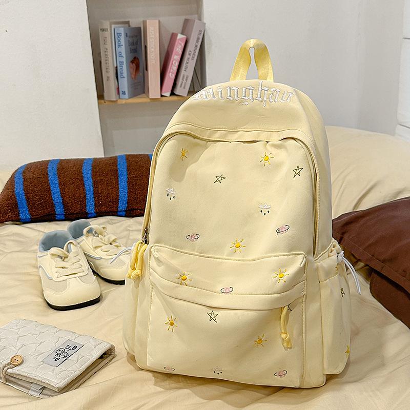Design sense dopamine embroidery large capacity junior high school bag ins niche female high school student lightweight backpack