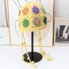 Handmade crocheted ear protection hat women's autumn and winter ethnic style colored flower knitted hat fringed strap ball bag head wool hat