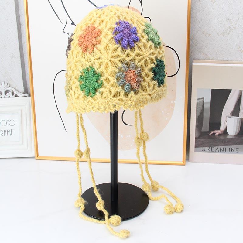 Handmade crocheted ear protection hat women's autumn and winter ethnic style colored flower knitted hat fringed strap ball bag head wool hat