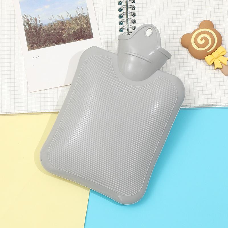Thickened, explosion-proof hot water bottle for girls with imitation rabbit fur; perfect as a hand warmer, stomach compress, or foot warmer.