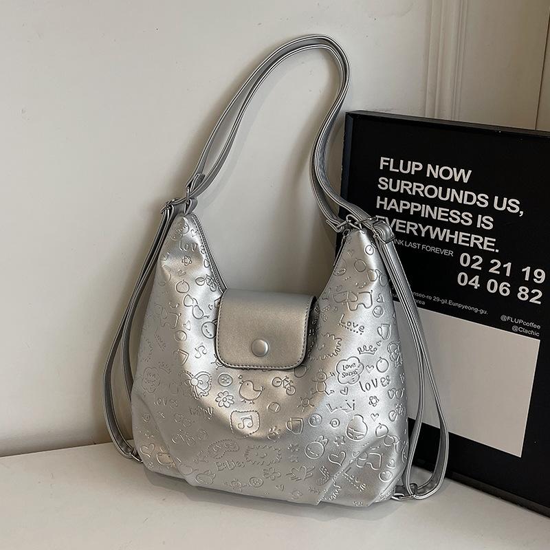 

High-quality new niche cute graffiti embossed large-capacity tote bag light casual soft leather multi-back shoulder bag