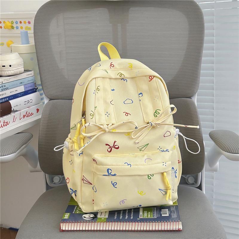 Cute Bow Tie Print School Backpack Lightweight Nylon Zipper Daypack with Front Pocket for Teen Girls Daily Travel