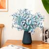 An artificial butterfly branch used for weddings, family offices, parties, decorating vases, and floral arrangements