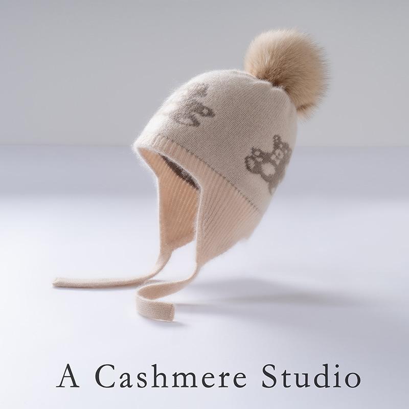 Autumn and winter children's cashmere fur ball jacquard warm knitted ear protection cashmere hat spot can be customized
