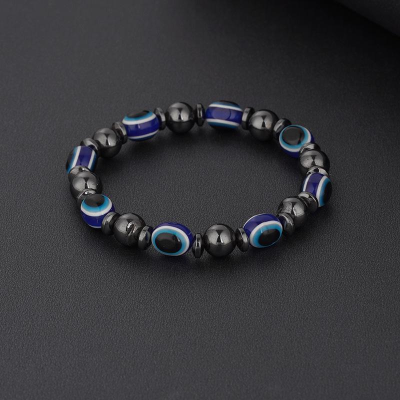 

2023 Европейско-американский черный желчный камень из натурального камня, магнитный браслет для пары с синими бусинами-глазками из смолы.