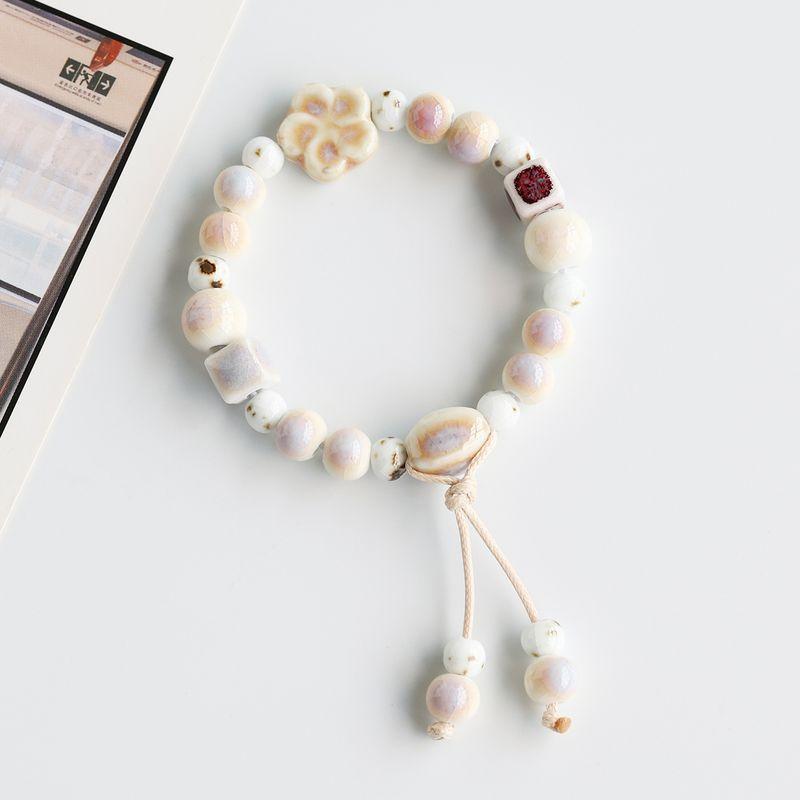 

Белый Элегантный Модный Орнамент Женский Керамический Браслет Цзиндэчжэньский Фарфор Розовые Бусины Плетеный Ручной Ремешок Национальный Стиль Студенческий Художественный Браслет Grassland Scenery