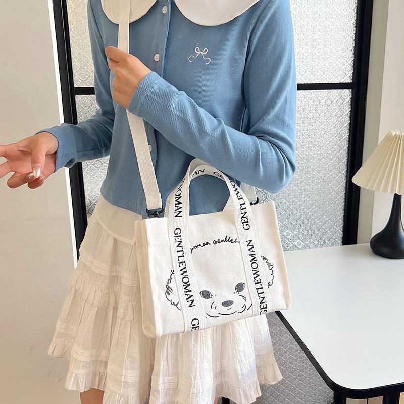 Geantă de mână casual din pânză pentru femei, 2025, nouă, la modă, cu cățeluș de desene animate, geantă de umăr, geantă messenger, geantă tote simplă
