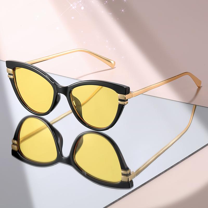 Fashion Cat Eye Sunglasses with Black Top Frame, Red Patterned Lower Frame, Gold Metal Arms, and Gradient Brown Lenses For