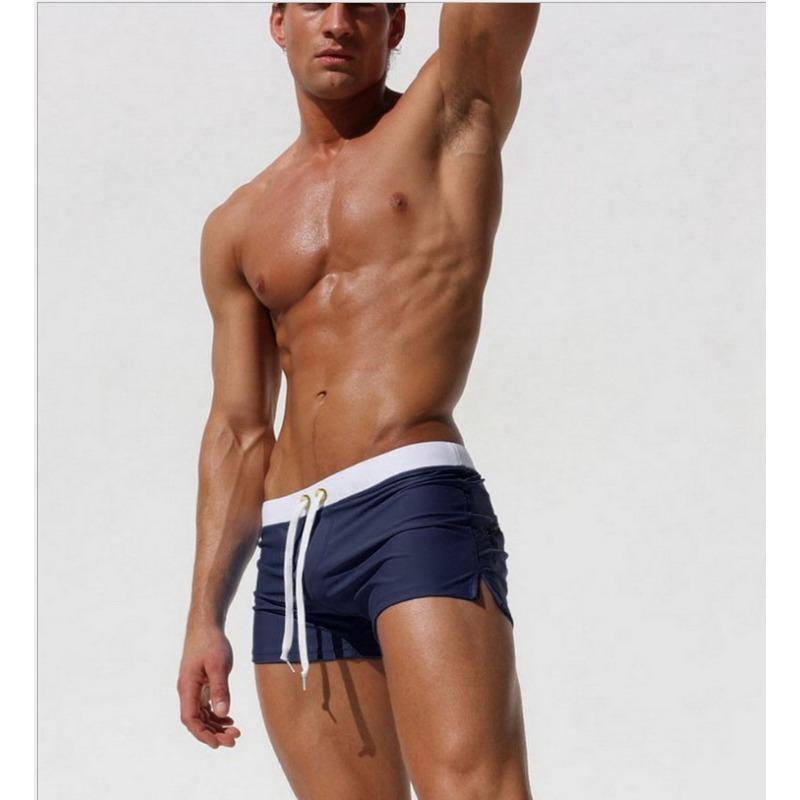 Men's solid color sexy and fashionable back pocket design, beach breathable quick-drying pants, boxer beach pants, swimming trunks.