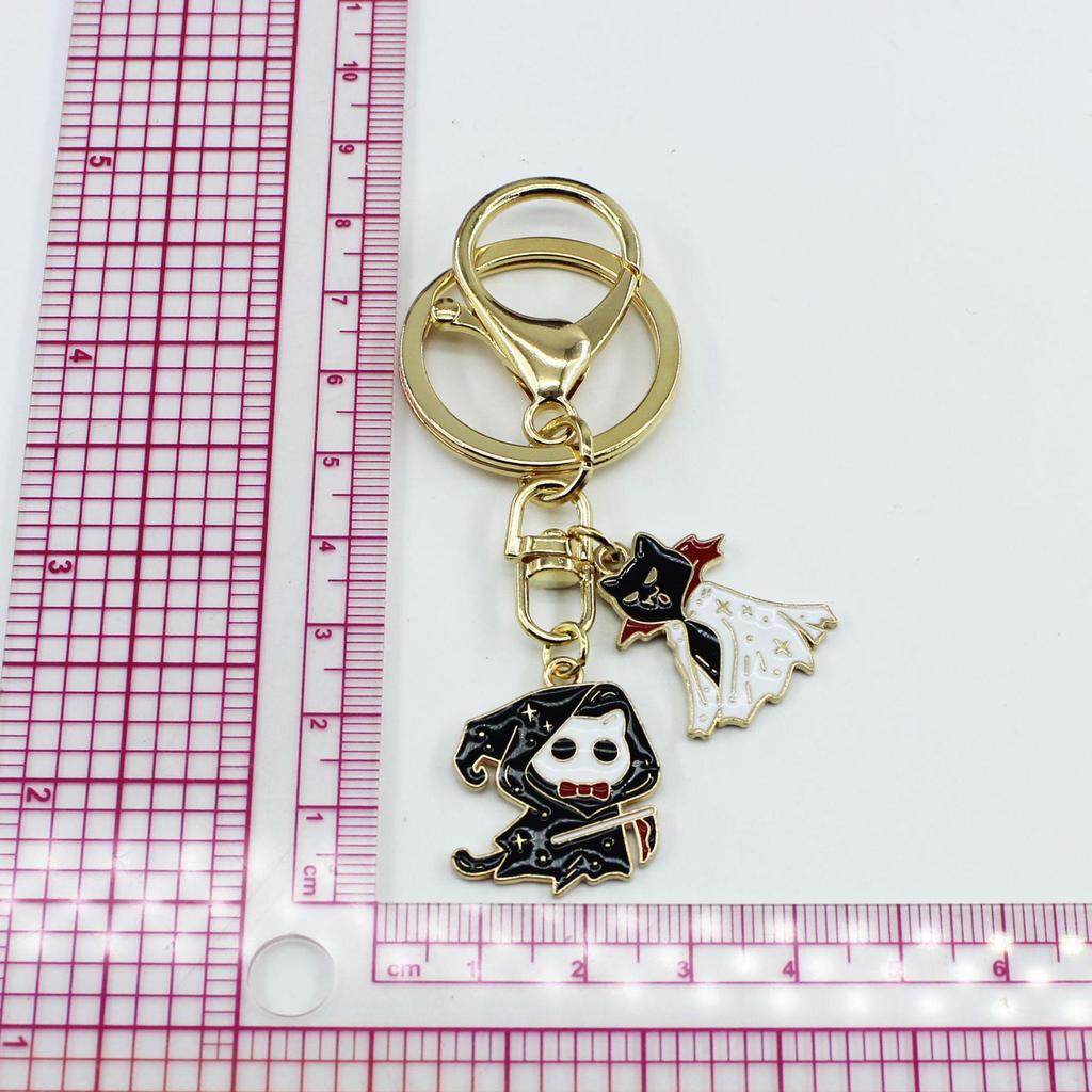 Halloween Cat & Bat Keychain with Wizard Hat, Drip Oil Skull, and Pumpkin Bag Pendant - Alloy Accessories.