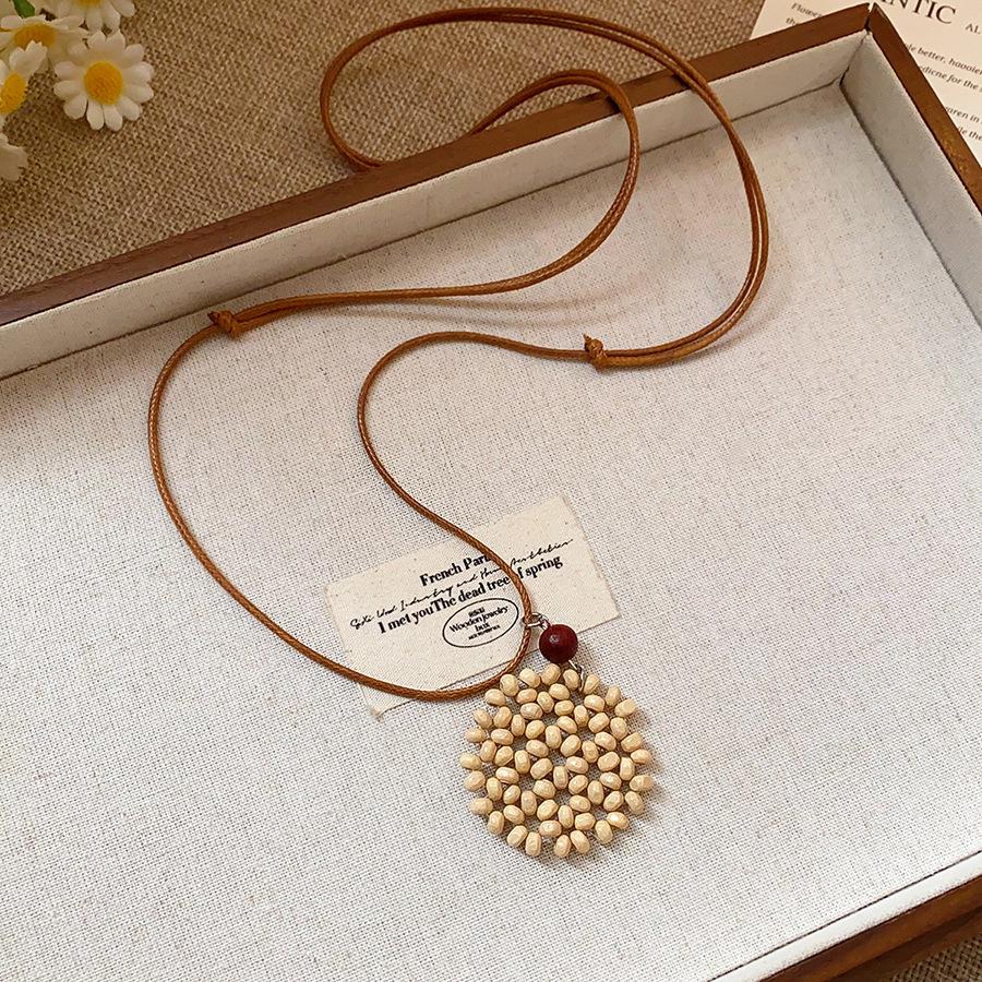 Retro Ethnic Heart Necklace: Wooden Flower Pendant Sweater Chain for Women