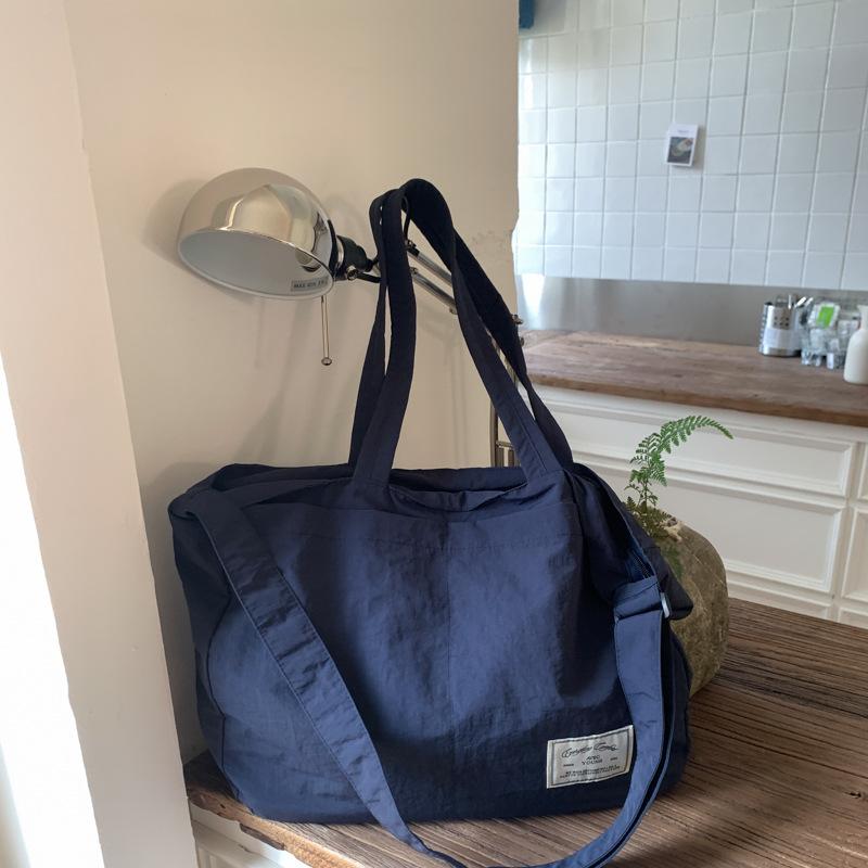 Canvas bag crossbody female Korean version fashionable simple large capacity student class lightweight simple solid color portable shopping bag
