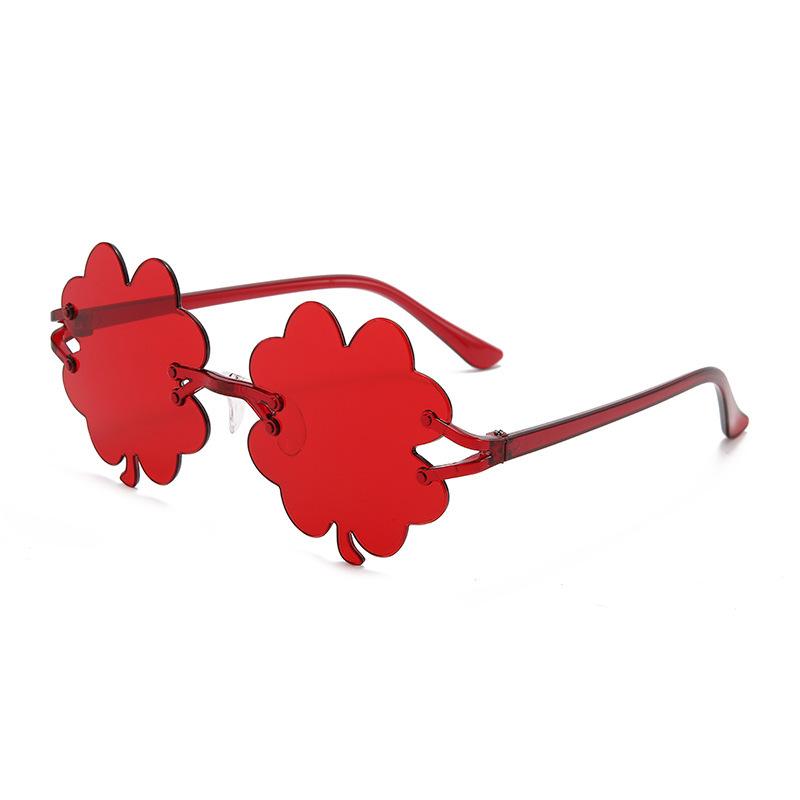 Four-leaf clover frameless candy-colored sunglasses, quirky street style fashion show decorative sunglasses