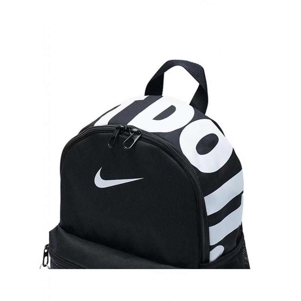 nike - brasilia jdi mini backpack - black/white Kid's (11L) -Black/White Gambol The Kids Nike Brasilia JDI 11L Backpack is perfect for carrying all of your kids gear Nike Kids' Nike Brasilia JDI