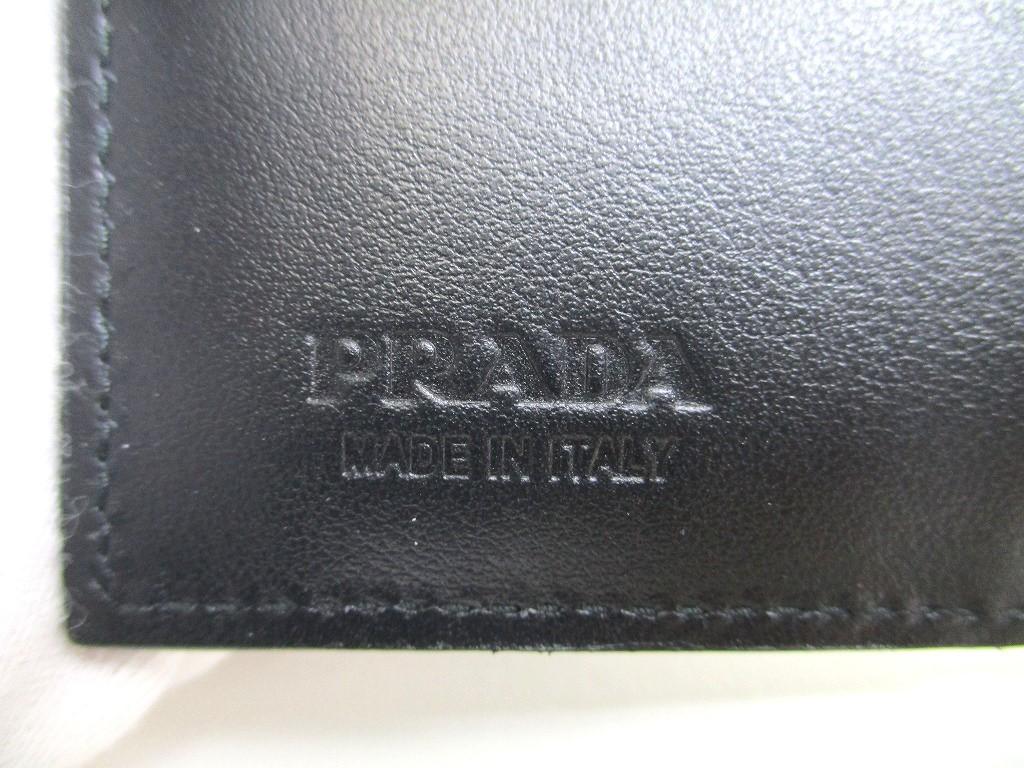 Prada Portefeuille compact à deux volets en cuir argenté et noir #a592