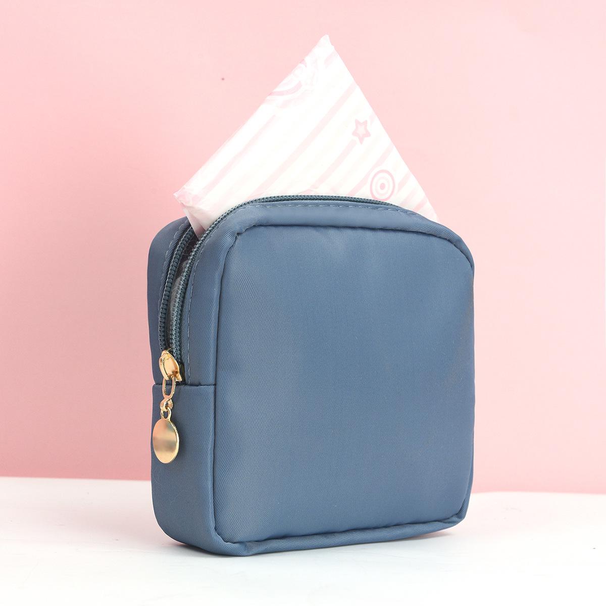 

Портативна сумка для зберігання гігієнічних прокладок великої місткості