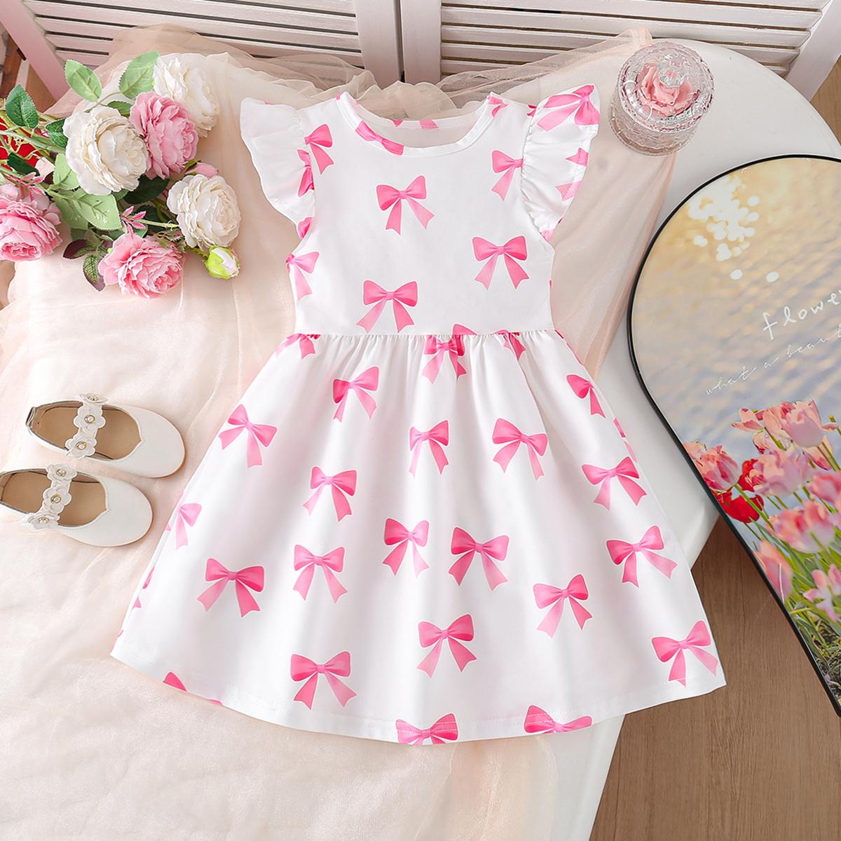 

Cute and stylish dress for little girls with all-over bow print, round neck, flutter sleeves, and a fitted silhouette, perfect for spring and summer. 7Y білий