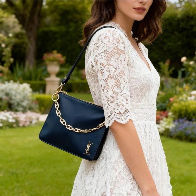 YSL black makeup crossbody bag with chain detailing, portable design, and large capacity, suitable for everyday use and travel.