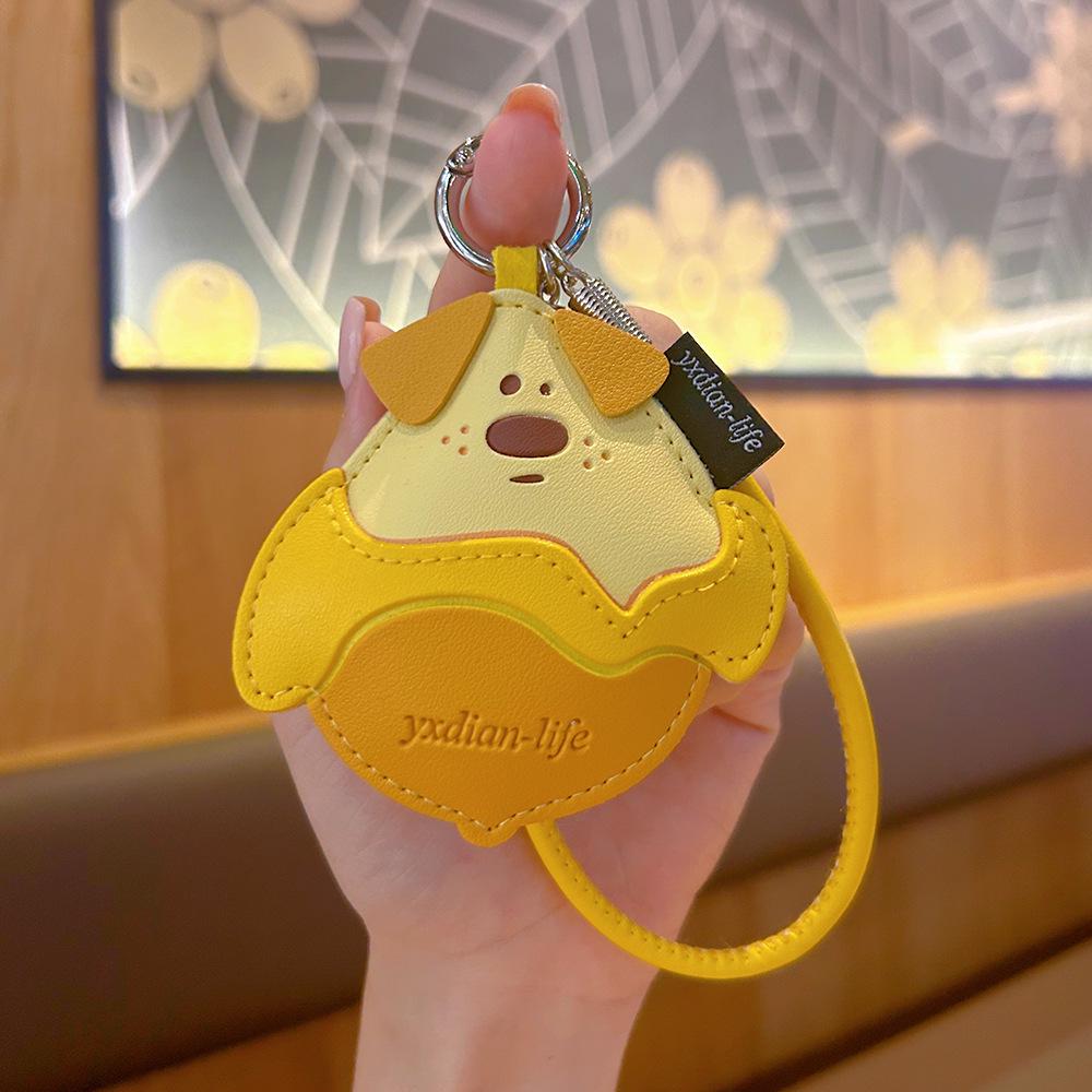 Creative Cartoon Mango Pudding Dog Leather Keychain - Cute Fruit Pendant for Girls Bags.