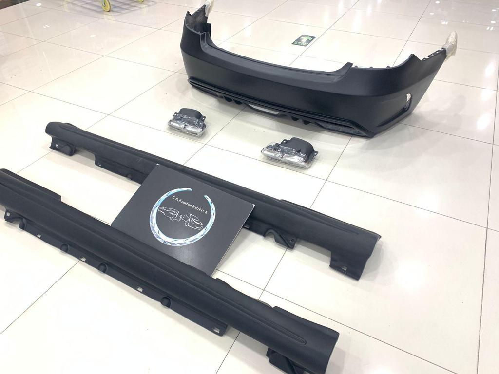 PD Style Body Kit for E-Class W207: Front Bumper, Rear Bumper, Side Skirts, Tailpipes.