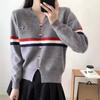 V-neck striped contrasting color puppy embroidered sweater women's autumn and winter loose design hem split long-sleeved knitted sweater
