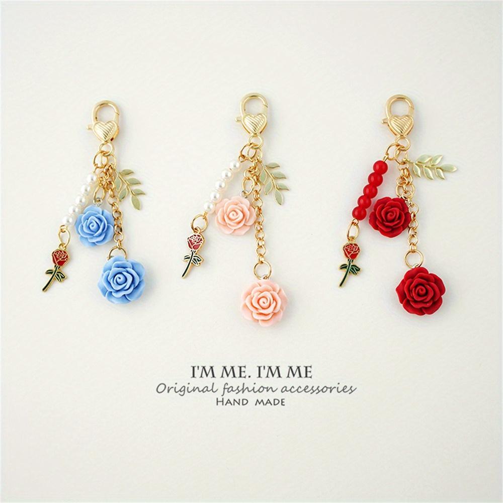 3D ვარდის ფისოვანი კამელიის გულსაკიდი გასაღების საკიდი მარგალიტის შენადნობი ქალებისთვის მანქანის გასაღების საკიდი ყურსასმენის ქეისი ხელჩანთის აქსესუარები