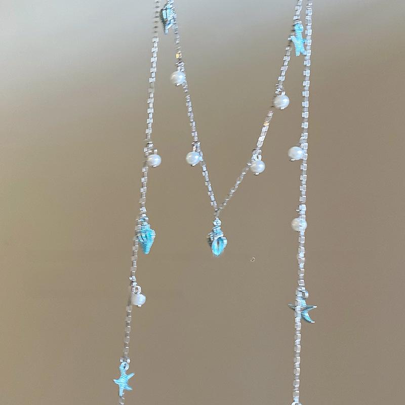 

Элегантное ожерелье-кисточка с синей морской звездой и жемчугом - Легкая роскошь, модная цепочка на ключицу, нишевый дизайн