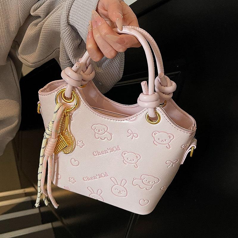 2025 new niche embossed fashion personalized portable bucket bag high-end commuter versatile women's messenger bag