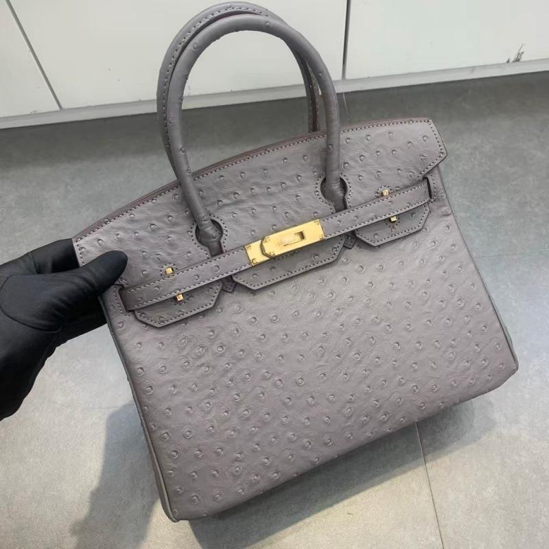 

Кожаная сумка Воловья кожа Фланелевая подкладка Ретро Высококлассное ощущение Сумка через плечо Женская сумка Магазин Поколение 30 серый