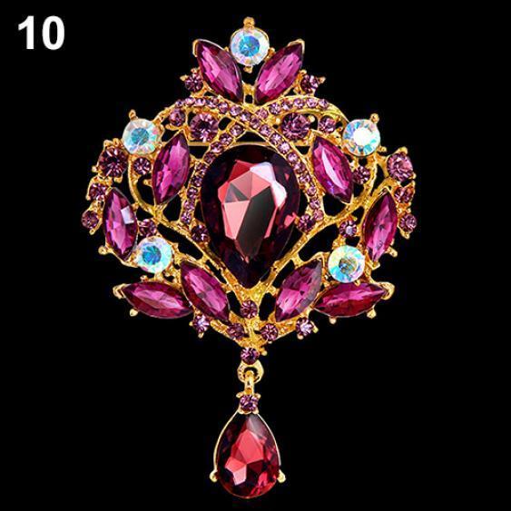 

Женская металлическая брошь с горным хрусталём фиолетовый/золотистый