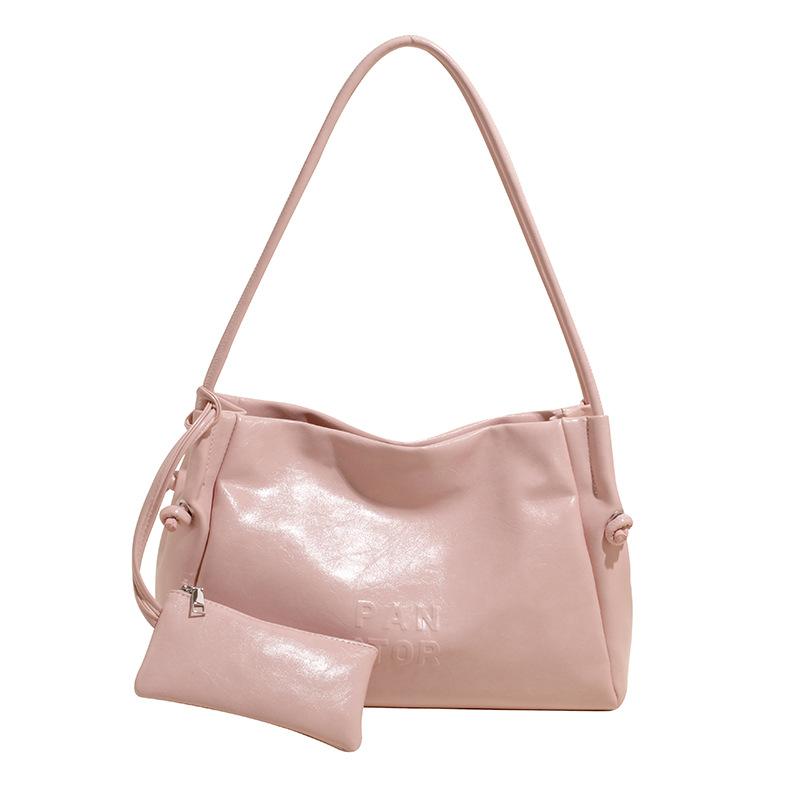 

В этом году популярна корейская версия высококачественной сумки-тоут из мягкой кожи большой вместимости для通勤, повседневная и универсальная модная женская сумка через плечо розовый