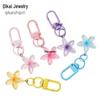 Colorful Daisy Keychain: Stylish Transparent Keyring & Bag Charm for Women