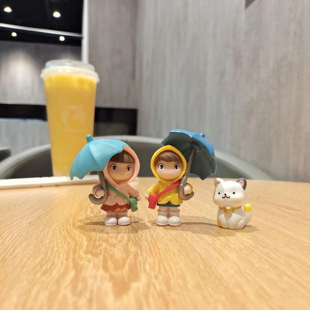 Cartoon Character Desk Ornament: Cute Umbrella-Holding Figure for Creative Office Decor