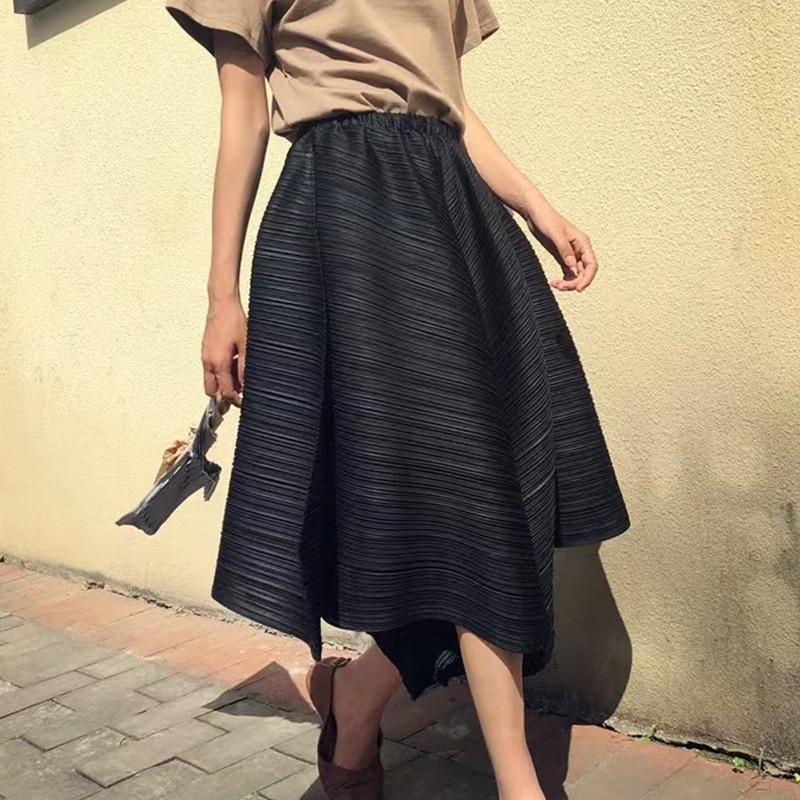 Pleated skirt pants with irregular hem and umbrella shaped loose wide leg pants